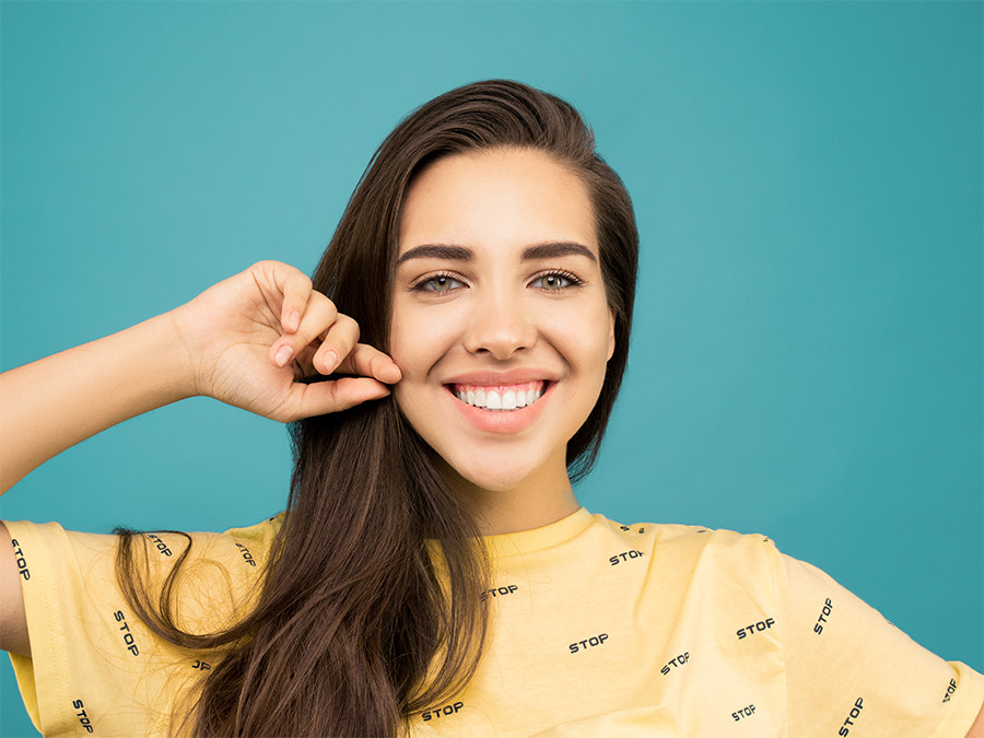 Woman smiling in yellow t-shirt